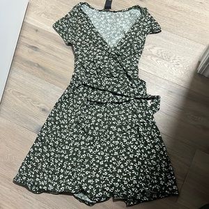 Green and white floral wrap dress